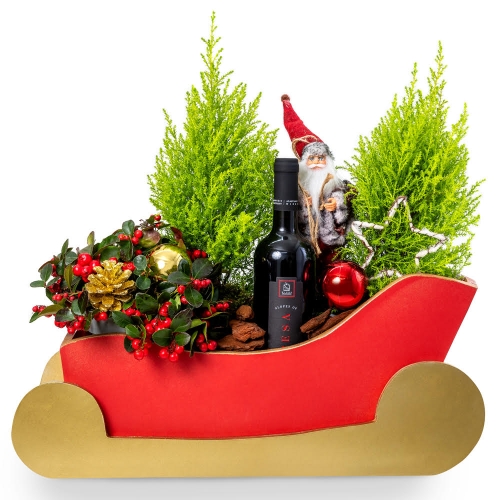 Sleigh with fir trees, wine and Christmas accessories