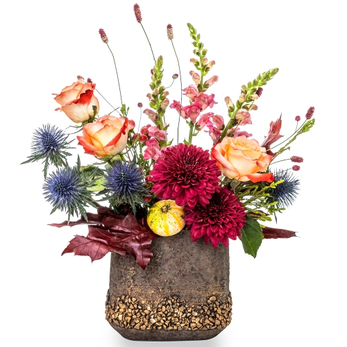 Floral arrangement with roses, chrysanthemum and antirinum in automn colors