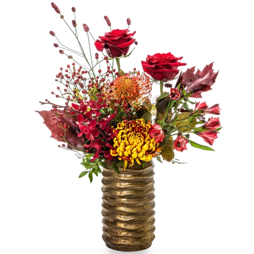 Red roses and autumn flowers in golden vase