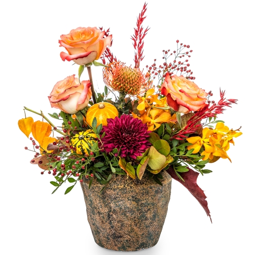 Round autumn flower arrangement in a big size stone vase