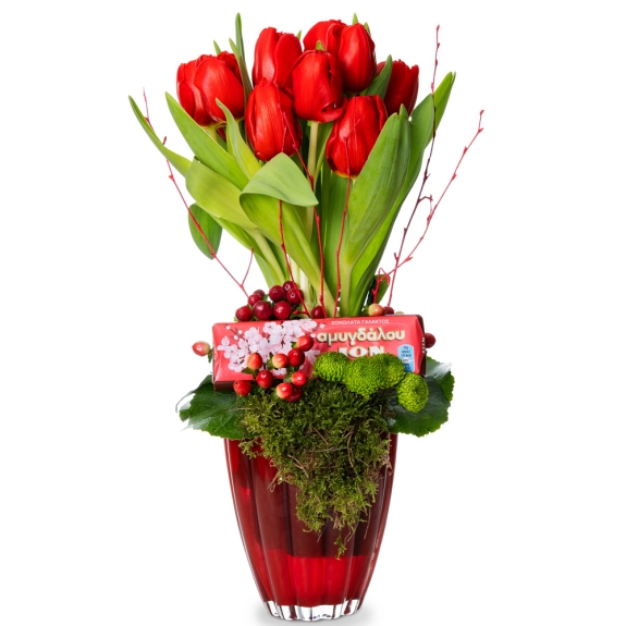 Red tulips and chocolate into red glass vase