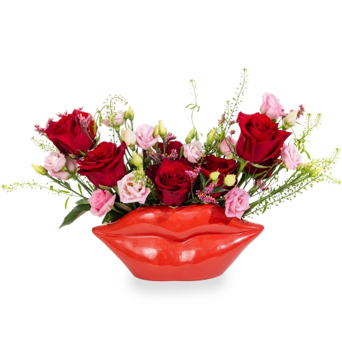 Pink-Red floral arrangement into lips pot