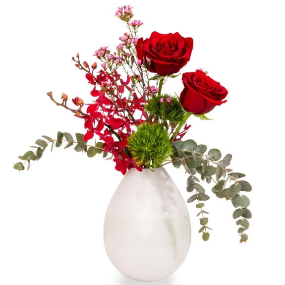 White vase with red roses and orchids 