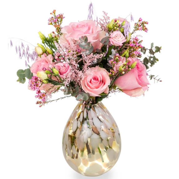 Glass pink-gold vase with a bouquet of pink roses